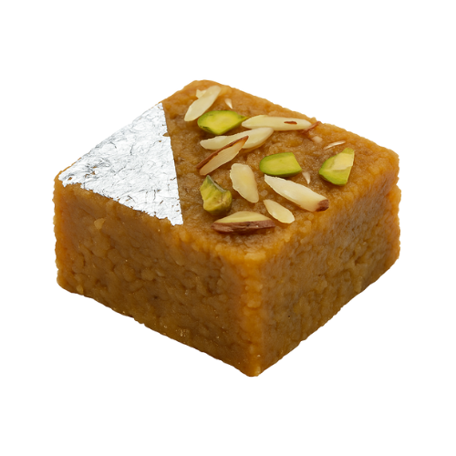 Mohanthal sweet garnished with almonds, pistachios, and silver foil – traditional Indian gram flour dessert.